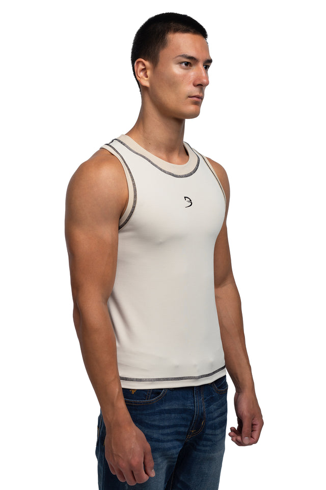 Three quarter front view of racer crew tank in ivory colorway on model.