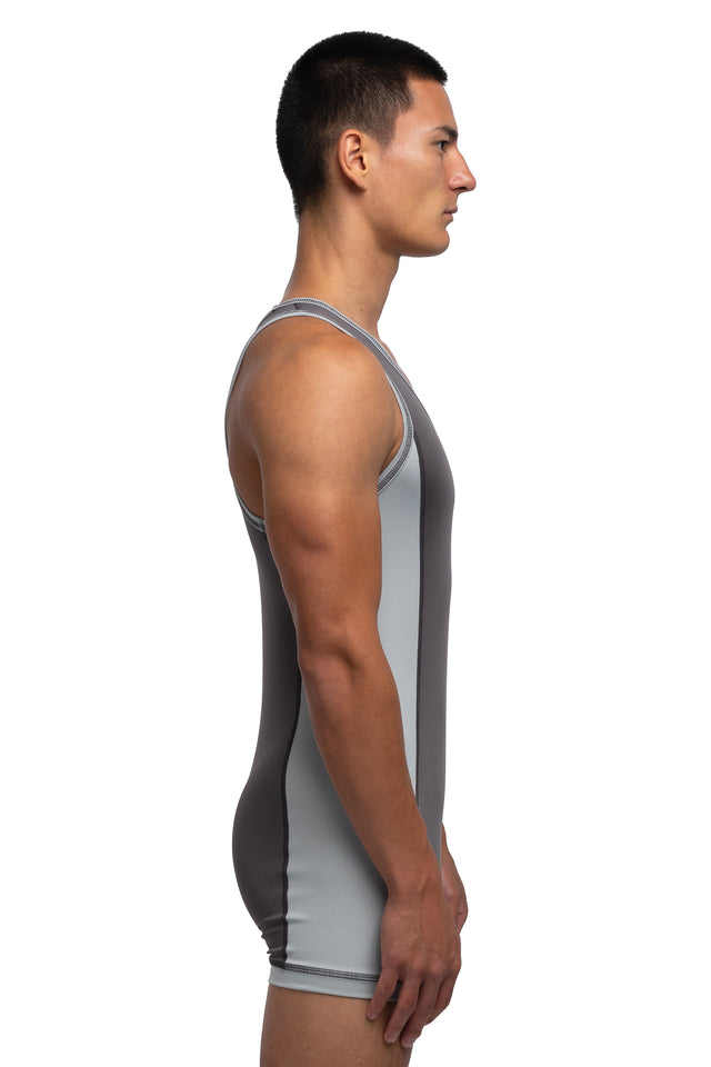 Side view of singlet in graphite/mist colorway on model.