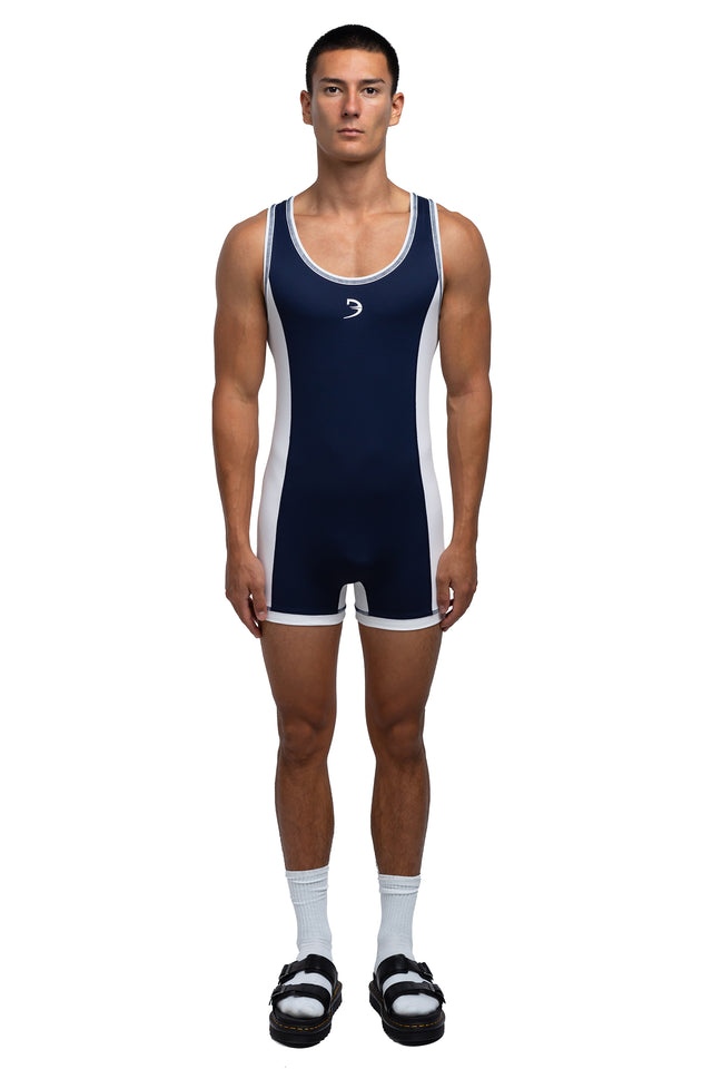 Full body front view of singlet in midnight blue/white colorway on model.