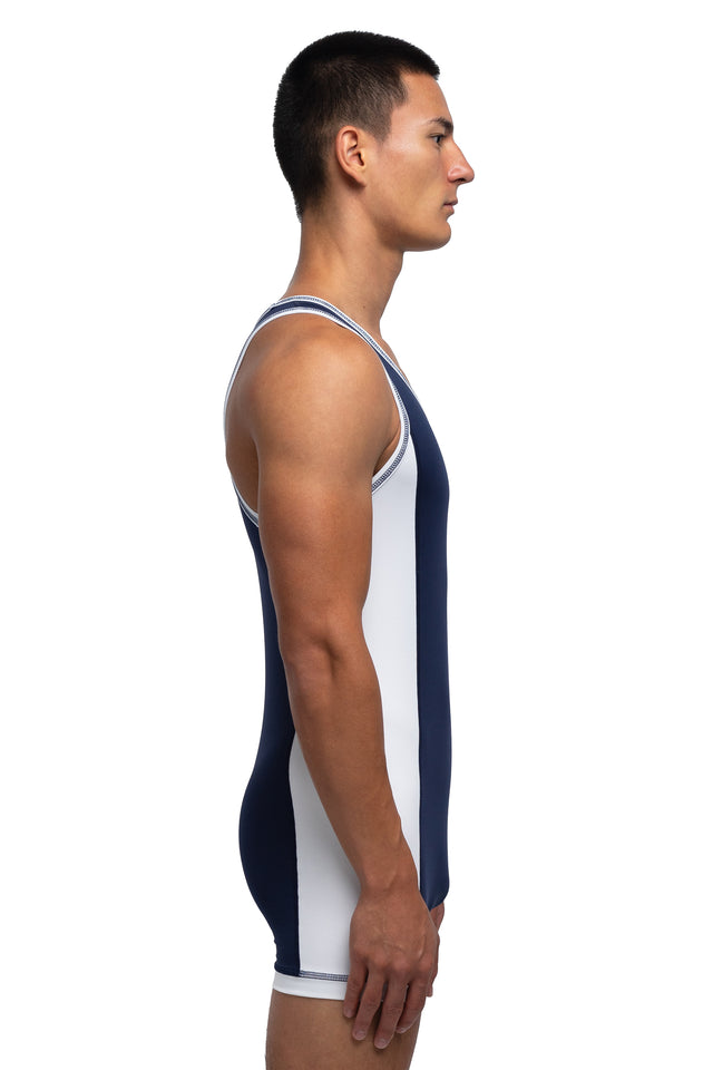 Side view of singlet in midnight blue/white colorway on model.