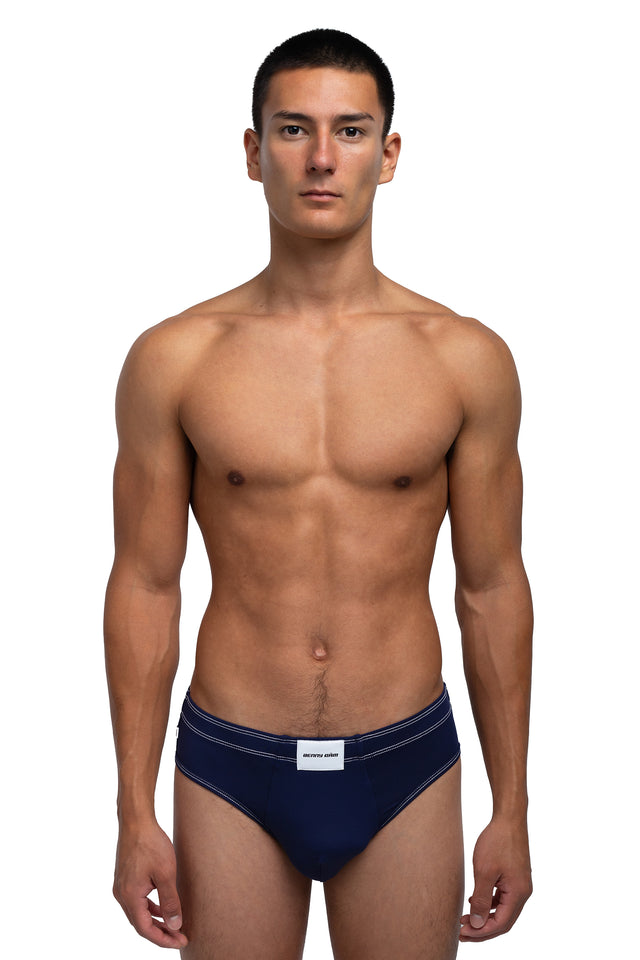 Front view of classic briefs underwear on model in midnight blue colorway.
