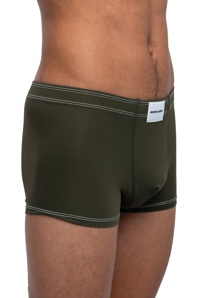 Three quarter front view of boxer briefs underwear on model in dark olive colorway. (Close up)