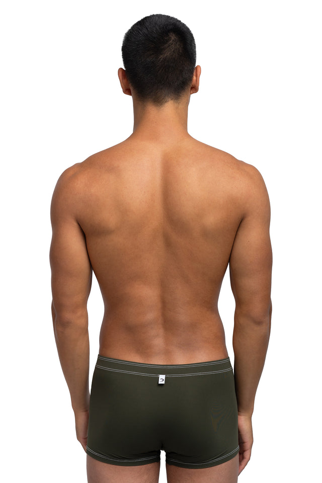 Back view of boxer briefs underwear on model in dark olive colorway.