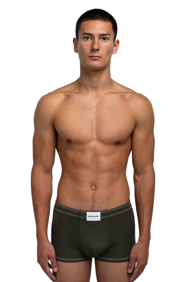 Front view of boxer briefs underwear on model in dark olive colorway.