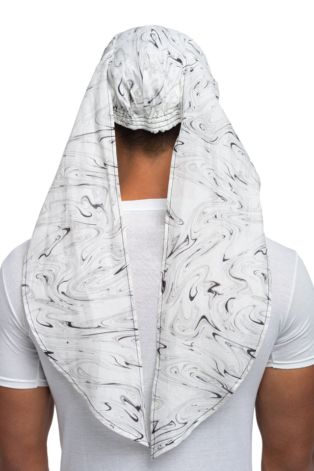 Back view of black & white colorway bandana hat worn on model with side panels untied.